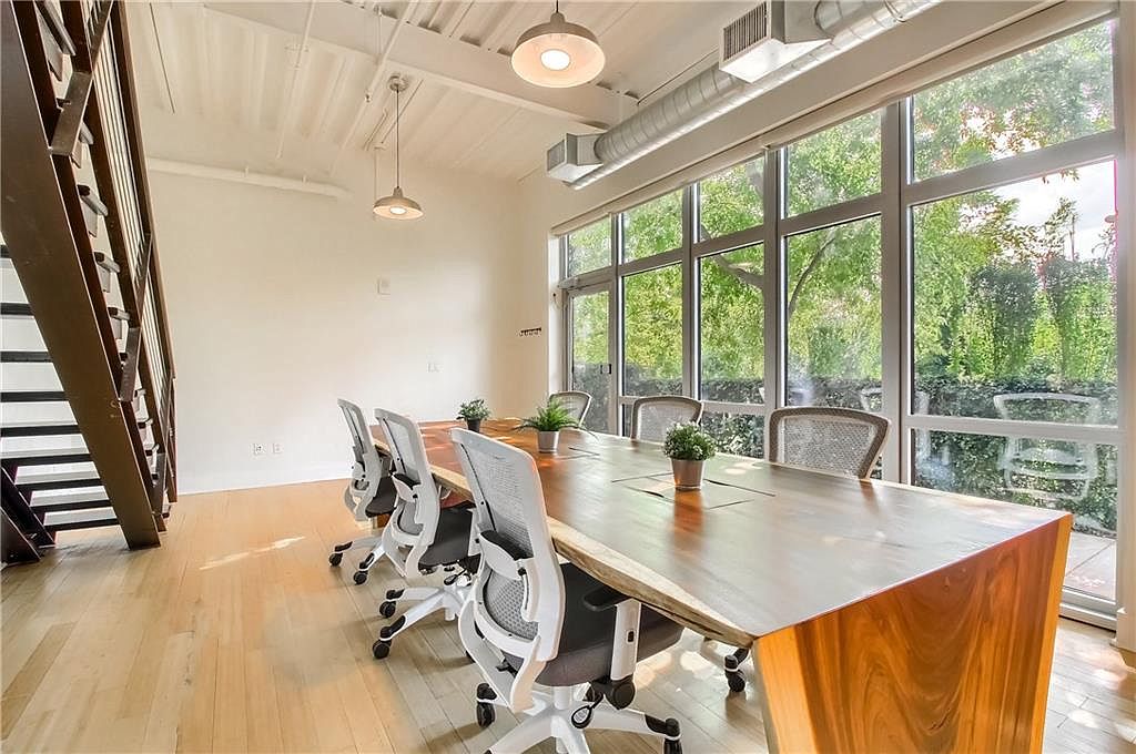 Conference area with boardroom table and natural light