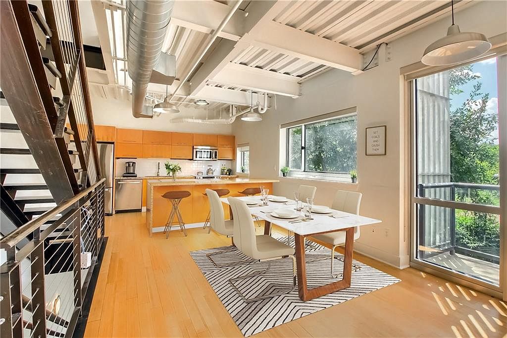 Open-plan level with kitchen and seating zone