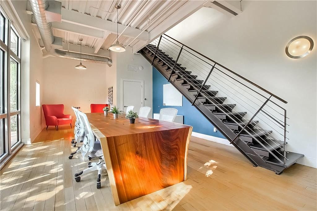 Wide-angle interior view showing open collaborative floorplate