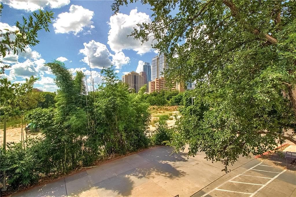 Private fenced patio with greenery